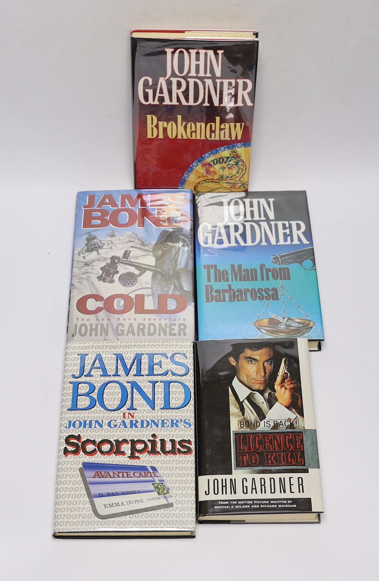 Gardner, John - Nine James Bond works, all 1st editions, all with d/j’s, consisting - License to Kill, 1989; Scorpius, 1988; Brokenclaw, 1990; The Man from Barbarossa, 1991; Death is Forever, 1992; Never Send Flowers, 19